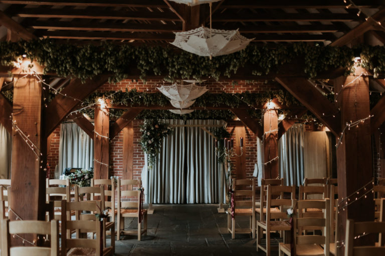 A beautiful vintage barn wedding ceremony held at The Ferry House barn wedding venue in Kent