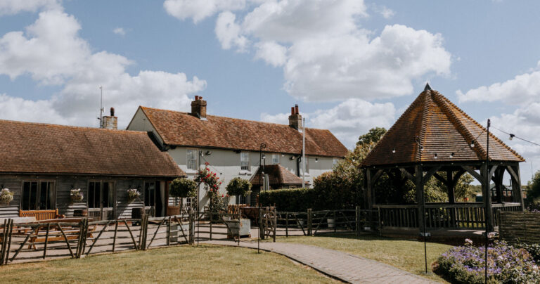 An exterior view of The Ferry House barn wedding venue in Kent